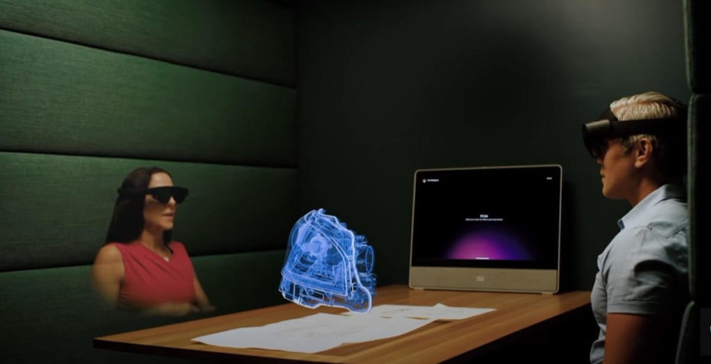 Una reuniñón de trabajo con un holograma como objeto de trabajo